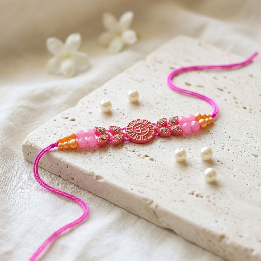 Traditional Devotional Pink Om Centerpiece Stone Encrusted Rakhi