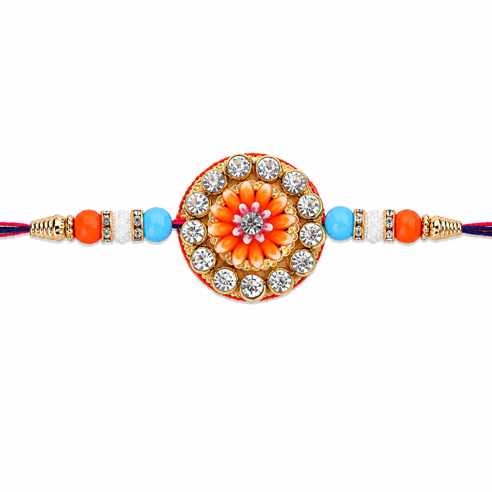 Circular Crystal Encrusted Floral Emblem Orange Accent Rakhi