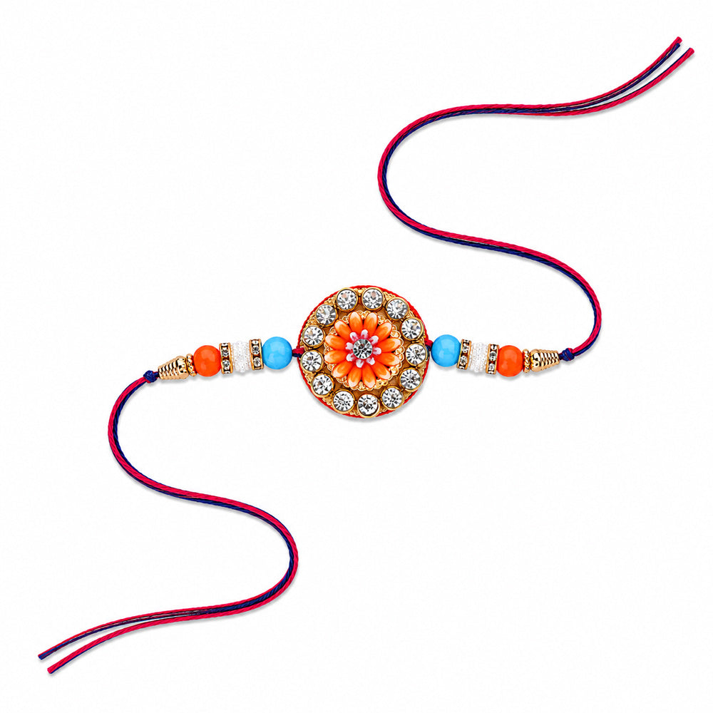 Circular Crystal Encrusted Floral Emblem Orange Accent Rakhi