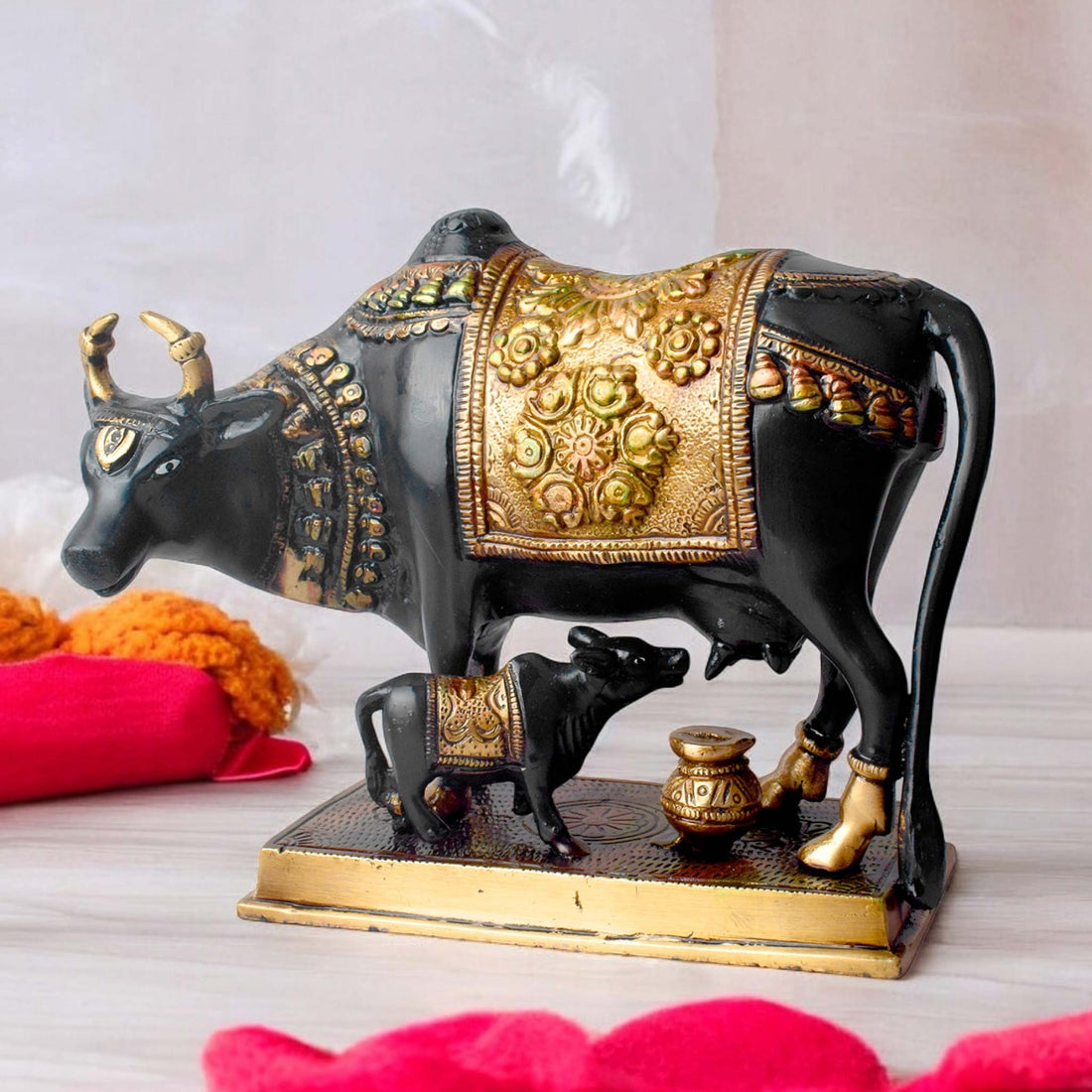 This 6.7-inch Kamdhenu cow figurine is a beautiful representation of purity, prosperity, and spiritual blessings. Known as the divine cow in Hindu mythology, Kamdhenu is believed to grant every wish and bring abundance to its devotees. Crafted with intricate details, this figurine exudes a sense of holiness and serenity.