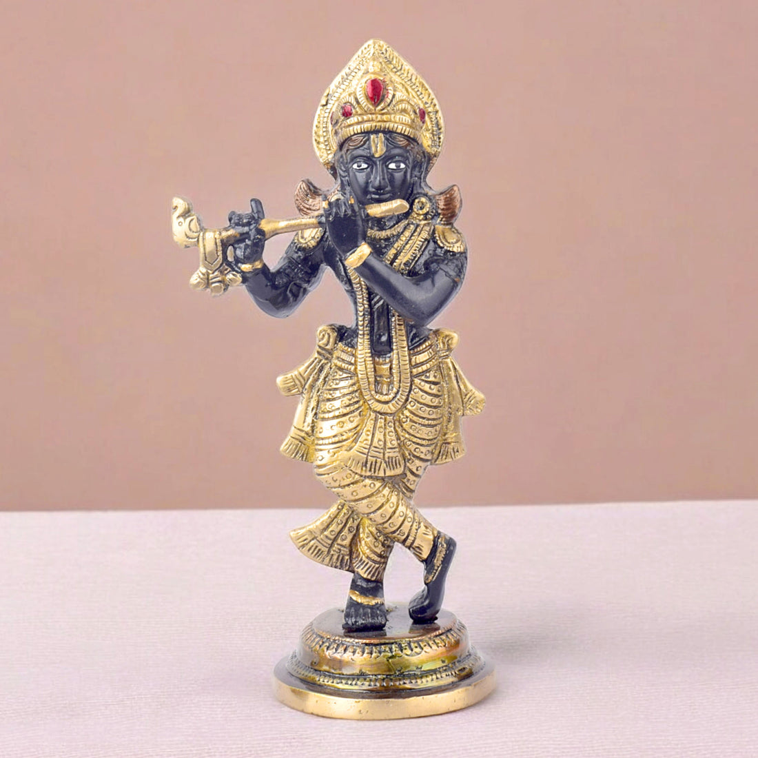 The 9.1 Inch Krishna Idol A Spiritual Icon of Joy and Devotion is a captivating representation of Lord Krishna's divine love and blissful energy. Crafted with exquisite detail, this idol showcases Krishna in a joyful and serene pose, with his flute in hand, symbolizing the music of the soul and the divine connection between the mortal and the eternal.