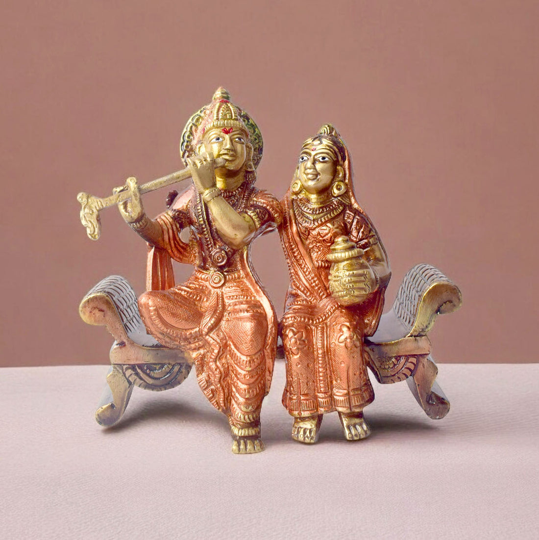The 4.7 Inch Graceful Sitting Radha Krishna on Bench β A Spiritual Masterpiece is a beautifully crafted idol that captures the essence of divine love and serenity. This exquisite piece features Radha and Krishna seated gracefully on a bench, symbolizing their eternal bond and peaceful companionship. Krishna, with his flute, and Radha, with a serene expression, reflect the harmonious union of the divine couple.