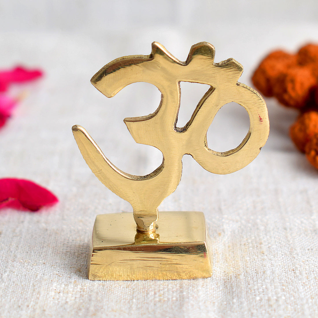 Elegant Brass OM Sculpture for Car Dashboard, symbolizing peace, spirituality, and divine energy, perfect for enhancing your vehicle's sacred decor. Indiaβs Largest Pooja Accessories Brand β www.satvikstore.in