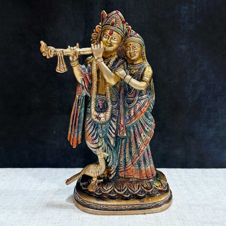 The 9 Inch Radha Krishna β Divine Presence in a Beautiful Idol is a stunning masterpiece that beautifully portrays the eternal love and devotion between Radha and Krishna. This intricately crafted idol captures the divine couple in an elegant and serene pose, with Krishna playing his enchanting flute and Radha radiating grace and love. No.1 Brass Idol Store www.satvikstore.in