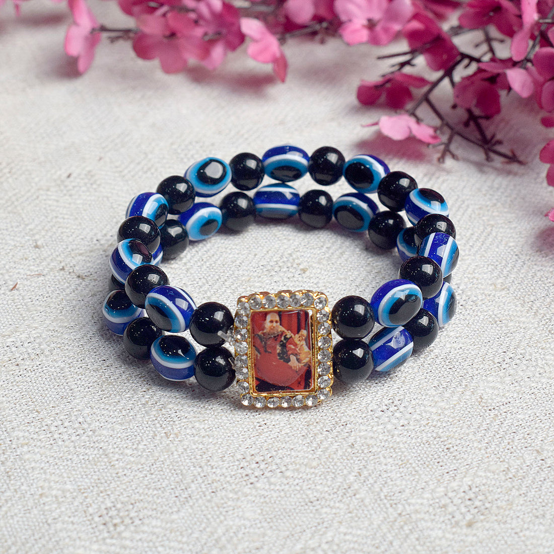 Black and Blue Evil Eye Round Pearl Bracelet with Jai Guruji Swaroop