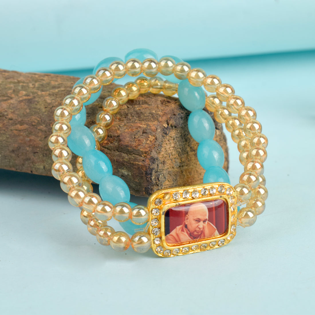 Golden Clear & Baby Blue Triple Layer Guruji Swaroop Bracelet featuring sparkling golden clear beads with a serene baby blue middle layer and Jai Guruji Swaroop – perfect for spiritual wear, meditation, and gifting. India’s Largest Pooja Accessories Brand – www.satvikstore.in