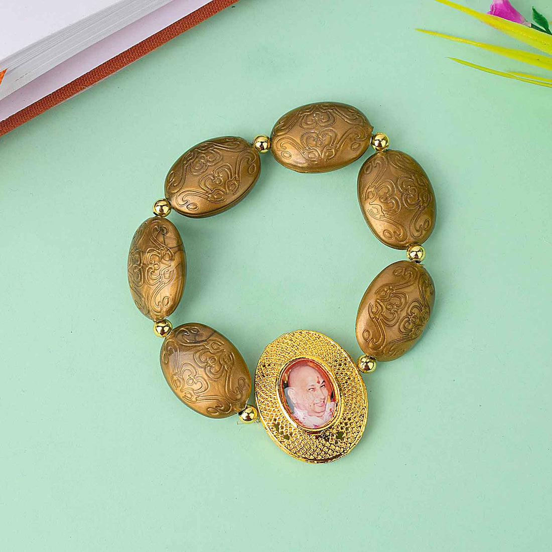 Guruji Swaroop Bracelet with chunky oval beads in golden, blue, purple, and pink – perfect for spiritual wear or gifting. India’s Largest Pooja Accessories Brand – www.satvikstore.in