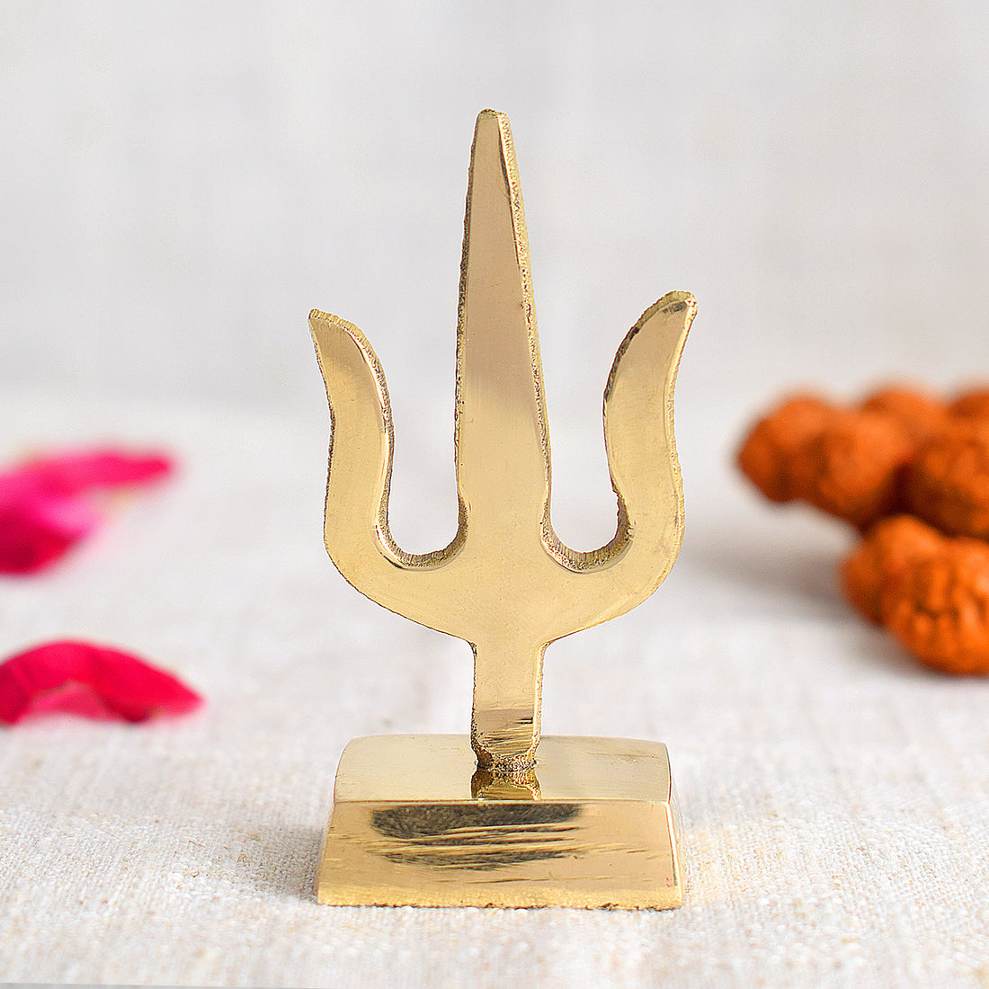 Elegant Trishul dashboard idol designed for cars, symbolizing divine power and protection, featuring fine craftsmanship to enhance spiritual aura and positivity while traveling. India’s Largest Pooja Accessories Brand – www.satvikstore.in