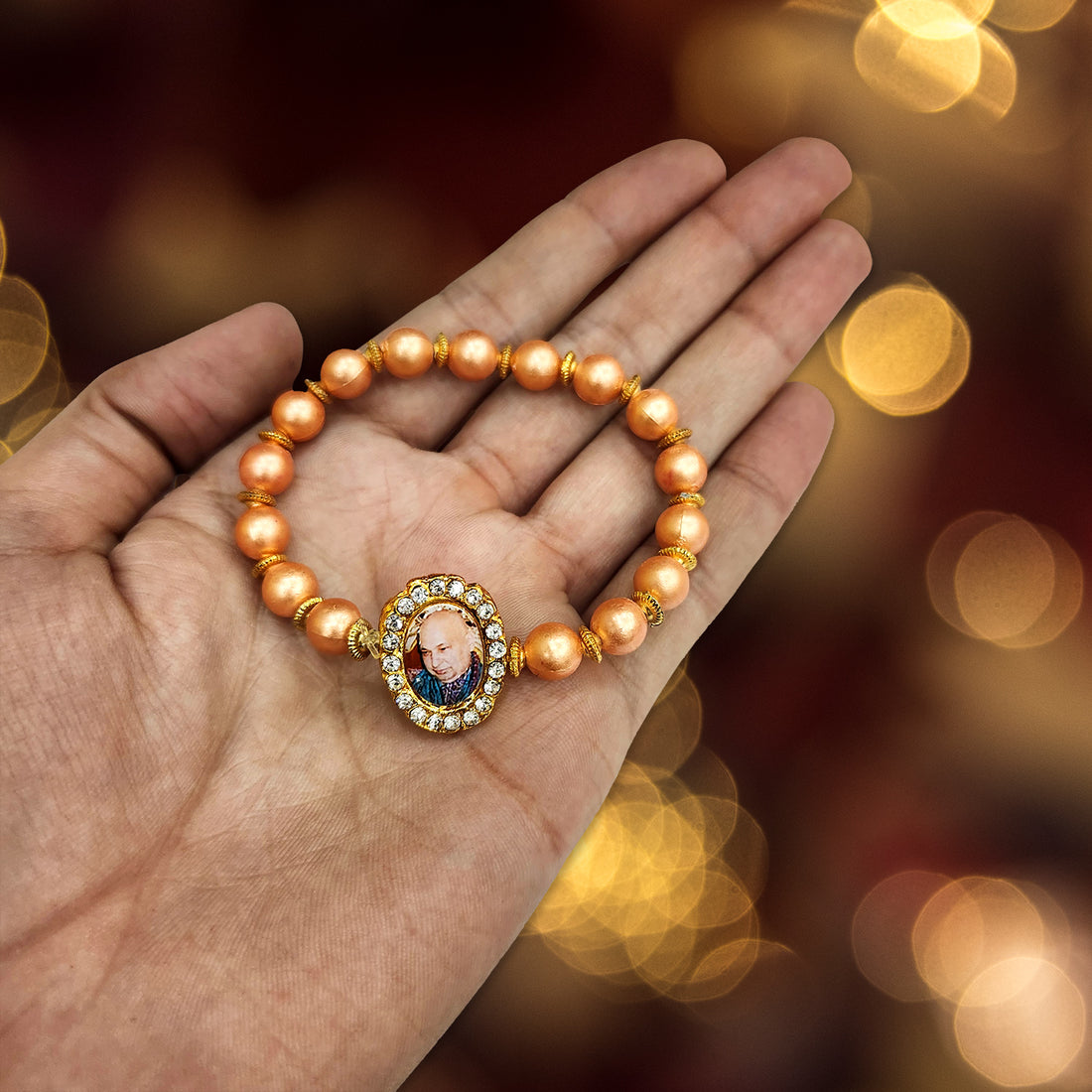 Orange Round Pearl Bracelet with Jai Guruji Swaroop