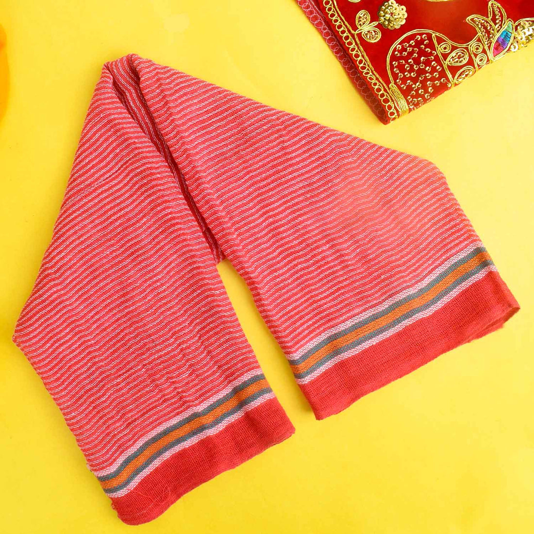 Divine Drapery: Red Cotton Gamcha for Worship is a sacred and soft cotton cloth used during spiritual rituals, offering purity and reverence. Perfect for covering deities and altars, enhancing pooja and worship experiences – India’s Largest Pooja Accessories Brand – www.satvikstore.in