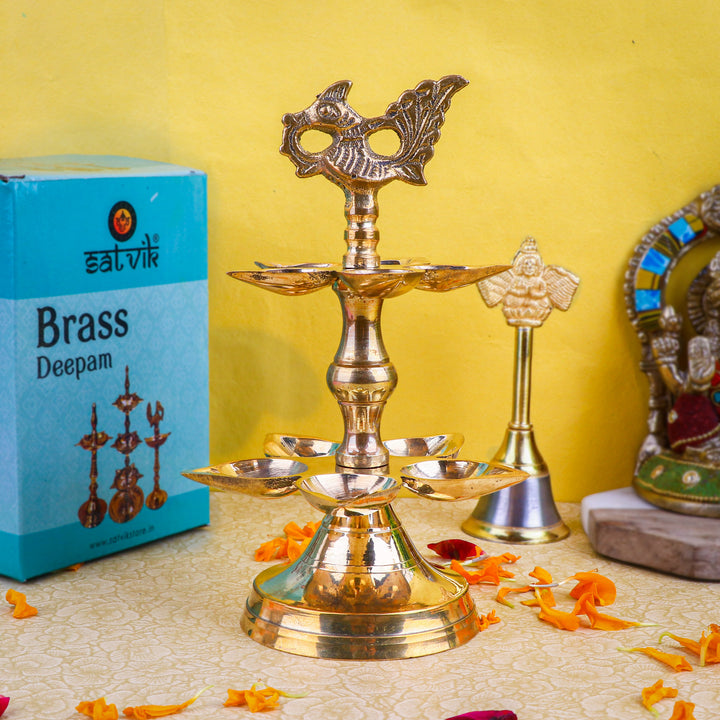 Brass 2 Step Panchmukhi Peacock Kerala Diya β Handcrafted brass diya featuring a two-step structure, Panchmukhi (five-faced) design, and peacock motif, perfect for pooja rituals, temple lighting, and traditional dΓ©cor. Indiaβs Largest Pooja Accessories Brand β www.satvikstore.in