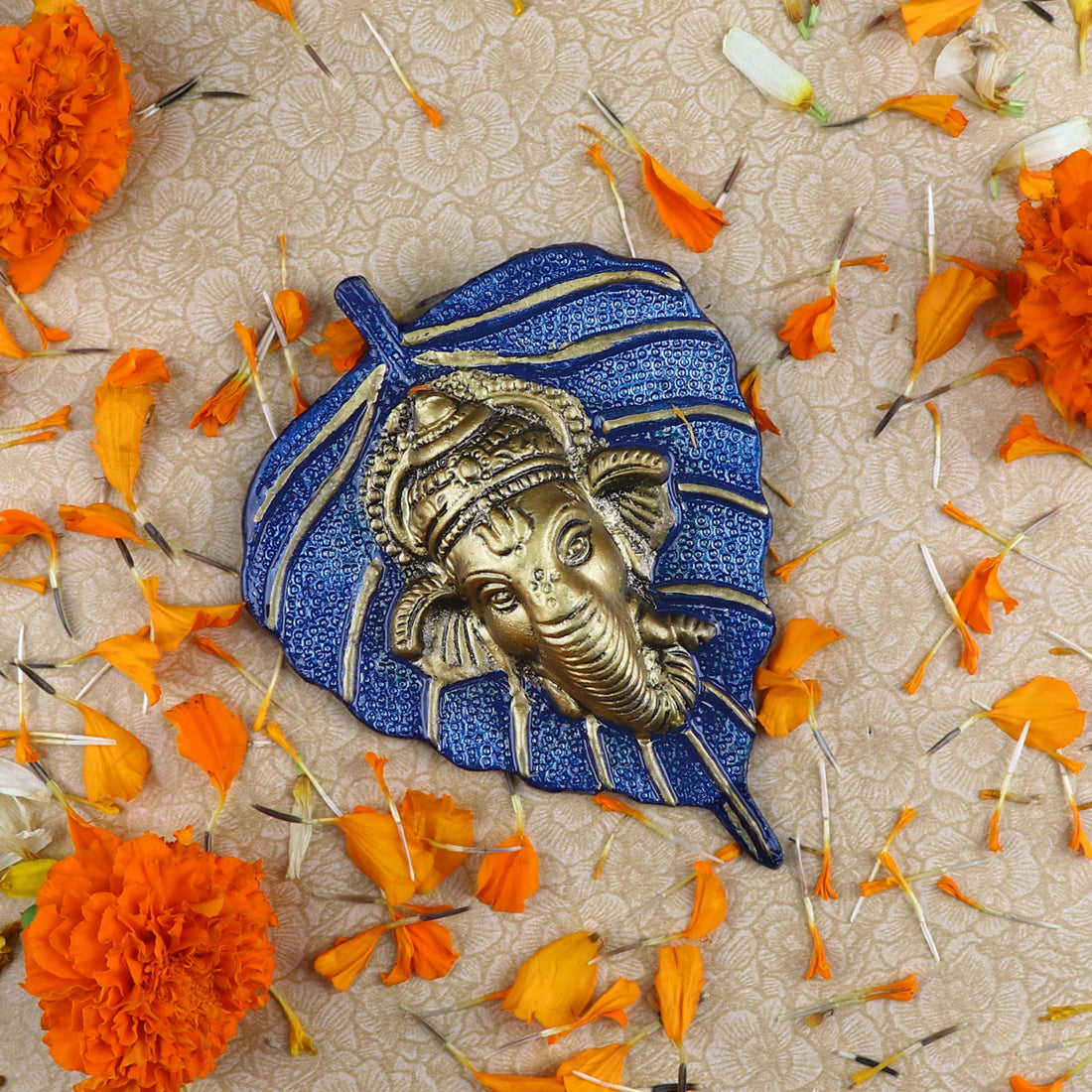 1 Pc Lord Ganesh Face on Leaf Patta Wall Hanging - Blue