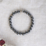 Hematite Bracelet Silver Buddha Charm Stylish Spiritual Wear