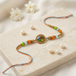 Golden Peacock Motif Floral Dial Orange and Green Bead Rakhi