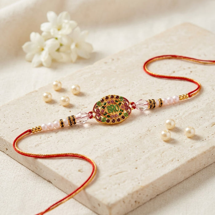 Vibrant Oval Gold Enamel Bro Centerpiece Designer Rakhi