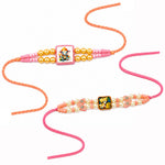 Divine Ganesha and Radha Krishna Pearl Beaded Rakhi (Set of 2)
