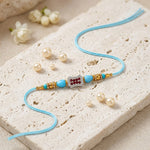 Auspicious Red and White Stone Studded Designer Rakhi