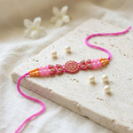 Traditional Devotional Pink Om Centerpiece Stone Encrusted Rakhi