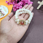 Off White Round Pearl Bracelet with Jai Guruji Swaroop