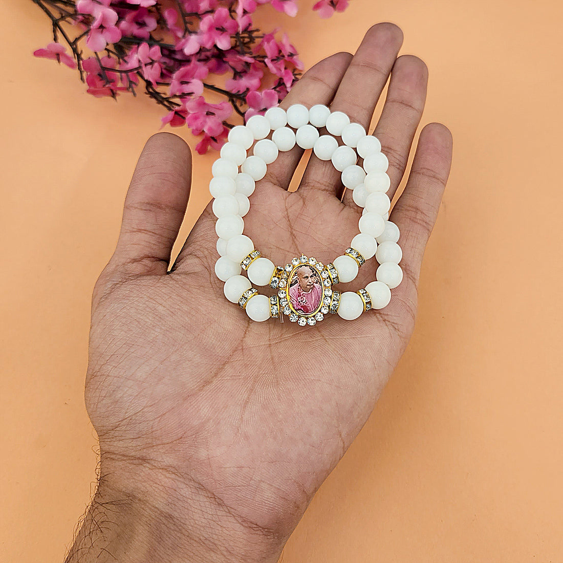 Off White Round Pearl Bracelet with Jai Guruji Swaroop