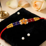 Vibrant Red Blue Crystal and Yellow Bead Wooden Floral Rakhi