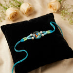 Divine Radha Krishna Emblem Pearl Accent Sky Blue Rakhi