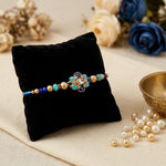 Handcrafted Floral Blue Meenakari and Beaded Rakhi