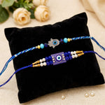 Modern Protection Hamsa Hand and Blue Evil Eye Rakhi (Set of 2)