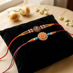 Traditional Divine Krishna and Orange Flower Rakhi (Set of 2)