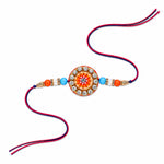 Circular Crystal Encrusted Floral Emblem Orange Accent Rakhi