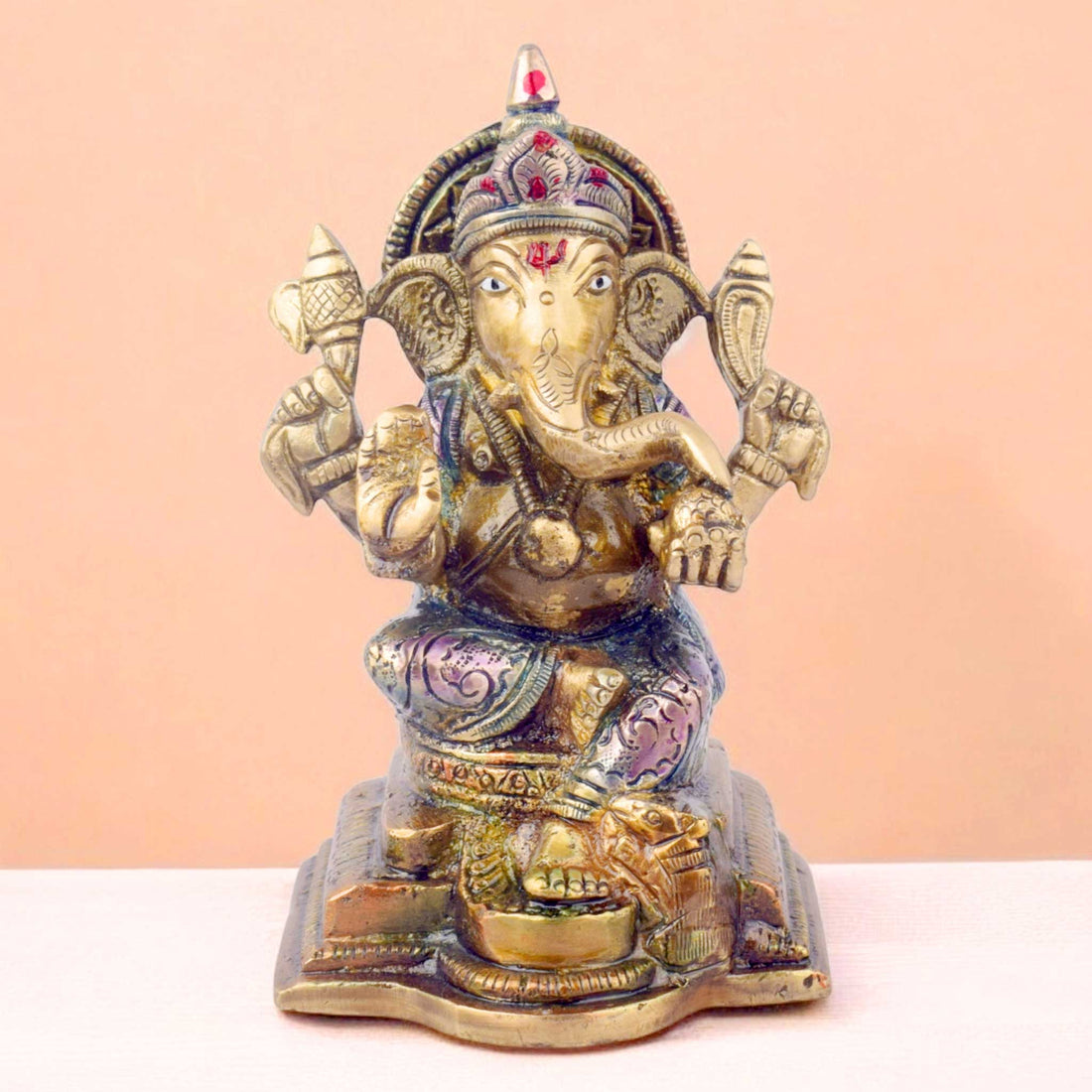  The "5.1 Inch Divine Ganesh Idol" is a beautifully crafted statue symbolizing wisdom, prosperity, and the removal of obstacles. Standing at 5.1 inches tall, this idol captures the serene and auspicious presence of Lord Ganesha, the beloved Hindu deity known for bringing good fortune and success. 