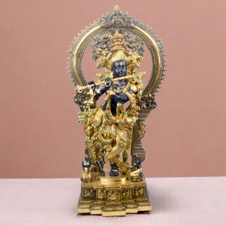 Bring divine elegance into your home with this stunning 32-inch Lord Krishna statue. Expertly crafted with intricate details, the statue beautifully portrays Lord Krishna in a serene and graceful stance. The engraved base adds a touch of traditional artistry, while the surrounding frame enhances its majestic presence.