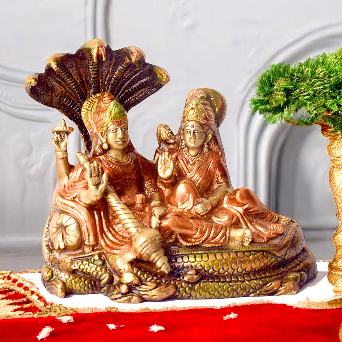 Beautifully crafted 6.1-inch Sacred Brass Vishnu Laxmi Statue featuring Lord Vishnu and Goddess Laxmi in divine form, seated together on an ornate pedestal, symbolizing wealth, protection, and spiritual harmony—perfect for temple, pooja room. No.1 Brass Idol Store www.satvikstore.in 
