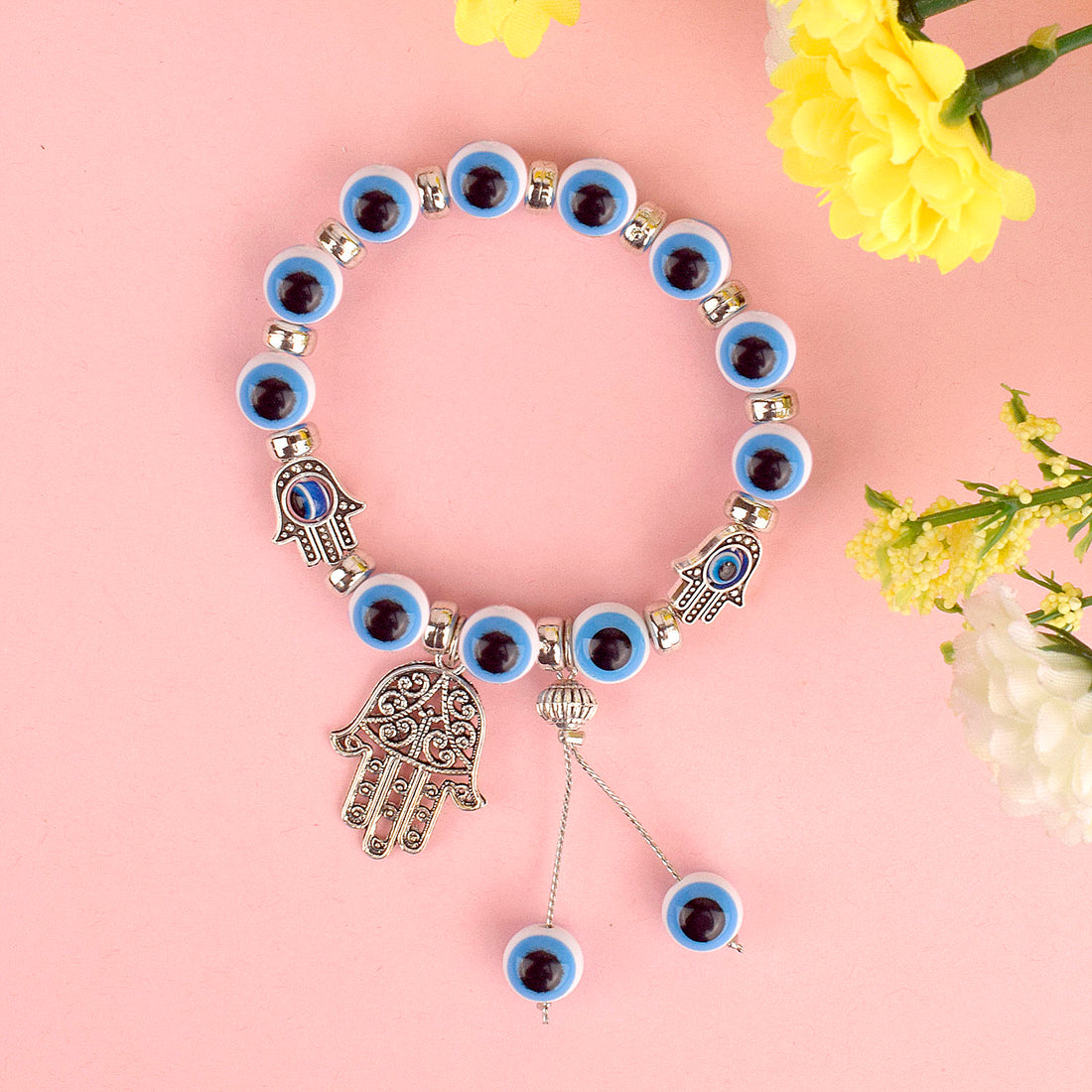 Blue Evil Eye Bracelet with Hamza Hand for Girls and Women, featuring an evil eye charm and Hamza hand for protection and style. India’s Largest Pooja Accessories Brand – www.satvikstore.in

