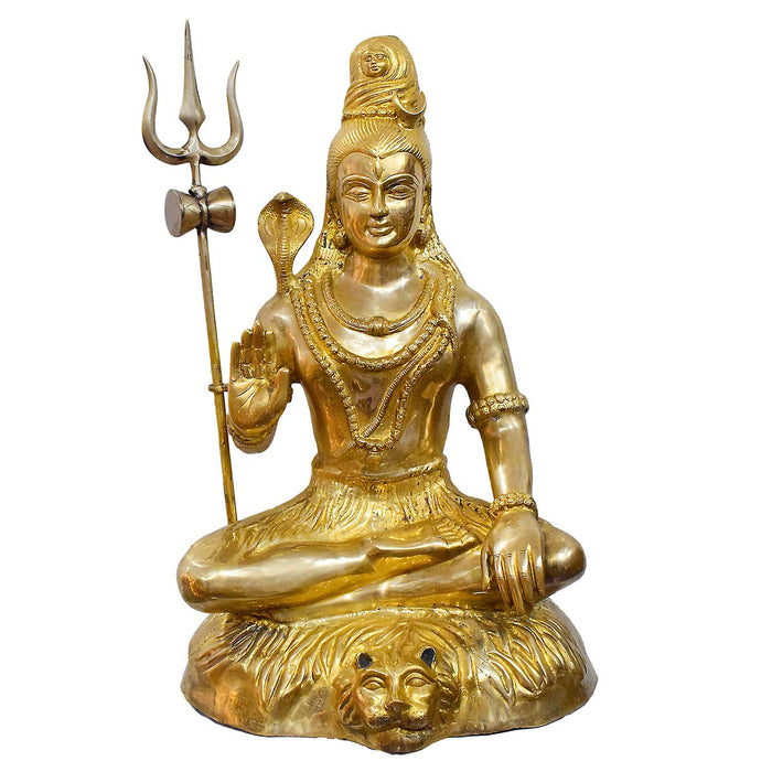 The handcrafted large brass statue of Lord Shiva is seated on a tiger skin, holding a Trishul and Damaru, glossy finish, weighing 35500 grams, height 80 cm, length 53 cm. Best for VIP Gift, best for big premium gift, best for your temple. India's Large Puja Accessories Brand - Satvikstore.in