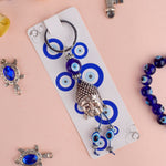 Alluring Silver Plated Buddha Keychain with Evil Eye