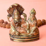  The 4.7 Inch Vishnu Ji Resting on Snake - Small Divine Figure is a beautifully crafted miniature statue that showcases Lord Vishnu in a serene and tranquil pose. Resting gracefully on the multi-headed serpent, Sheshnag, this divine figure symbolizes the eternal peace and protection Vishnu provides to the universe. 