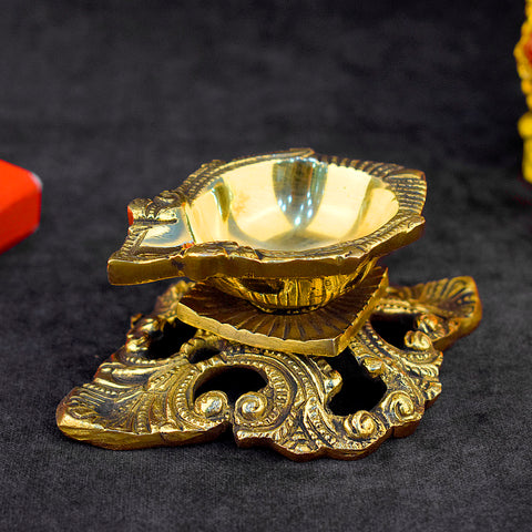 Designer Brass Diya – A beautifully crafted and ornate oil lamp made from high-quality brass, perfect for spiritual rituals, poojas, and as a decorative piece for your home or temple.  India’s Largest Pooja Accessories Brand – www.satvikstore.in
