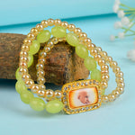 Golden Clear & Green Triple Layer Guruji Swaroop Bracelet featuring sparkling golden clear beads with vibrant green middle layer and Jai Guruji Swaroop – perfect for spiritual wear, meditation, and gifting. India’s Largest Pooja Accessories Brand – www.satvikstore.in