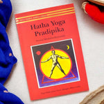 Front cover of the "Hatha Yoga Pradipika: Light on Hatha Yoga" paperback edition, a classical guide on traditional Hatha Yoga practices. India’s Largest Pooja Accessories Brand – www.satvikstore.in