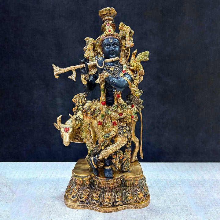 Enhance your space with the divine presence of this 17-inch Brass Krishna Statue with Cow. This beautifully crafted sculpture features Lord Krishna in a serene pose, accompanied by a cow, symbolizing the deep connection between the divine and nature.