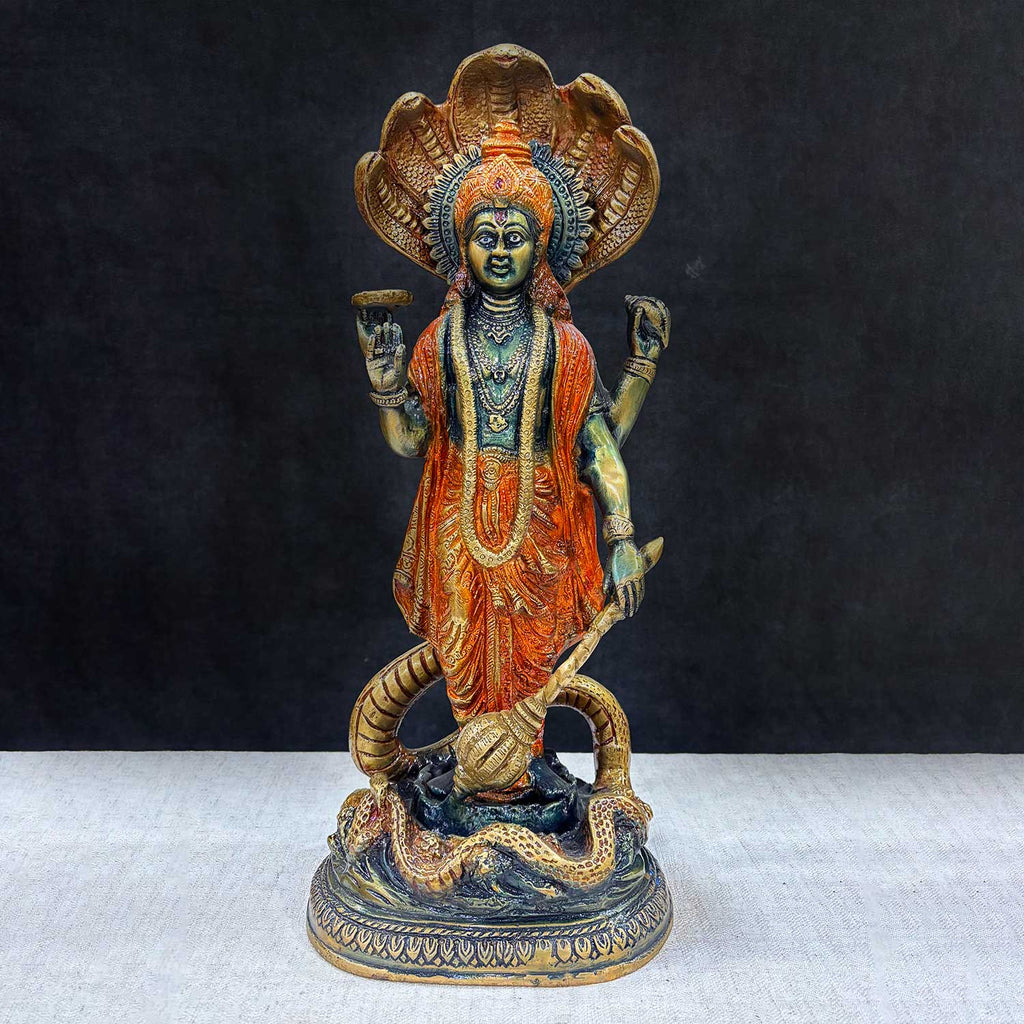  Bring divine protection and blessings into your home with this stunning 17-inch Brass Vishnu Standing with Sheshanag Idol. This intricately crafted statue features Lord Vishnu, the preserver of the universe, standing gracefully atop the Sheshanag (cosmic serpent). 