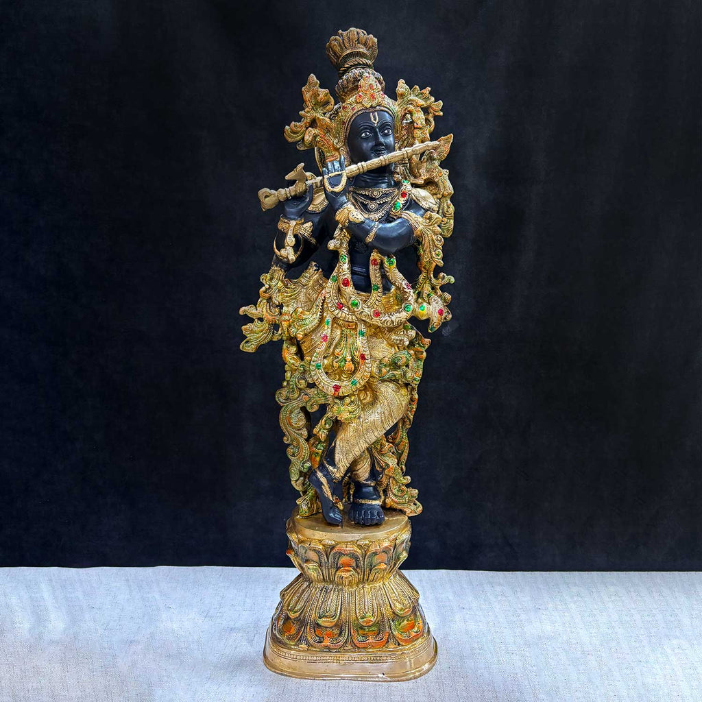  Elevate your space with the majestic 28-inch Brass Krishna Sculpture, designed with exquisite artistic detailing. This grand piece beautifully depicts Lord Krishna in a graceful and serene posture, showcasing intricate craftsmanship that highlights every delicate feature. 