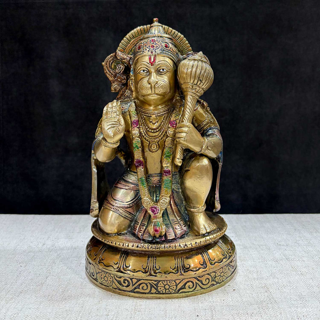 The "10.6 Inch Brass Hanuman Idol – Protector of Courage and Faith" is a stunningly detailed representation of Lord Hanuman, the embodiment of strength, devotion, and unwavering courage.