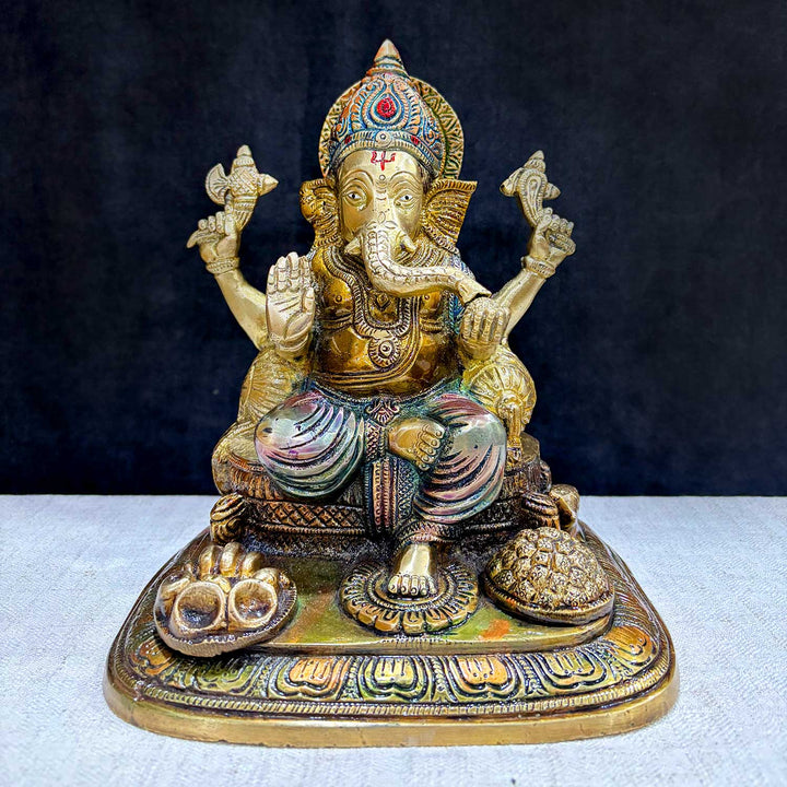 The "9.1 Inch Sacred Ganesh Idol" is a beautifully crafted statue of Lord Ganesha, symbolizing wisdom, success, and the removal of obstacles. Standing at 9.1 inches tall, it features intricate detailing and traditional attributes like the axe, lotus, and modak.