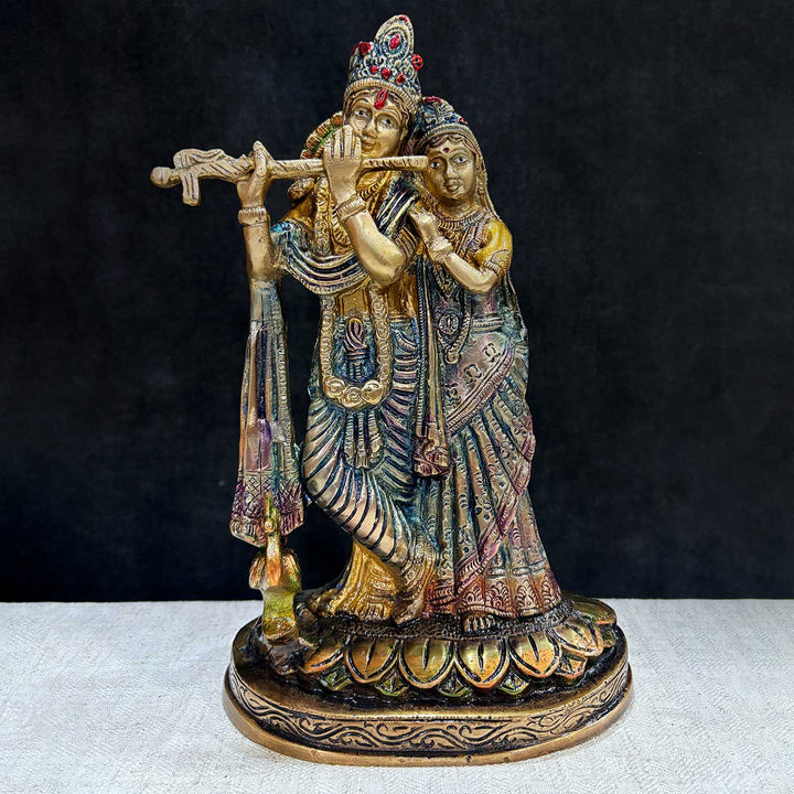 The 10 Inch Radha Krishna Idol for Your Altar is a stunning depiction of divine love and spiritual harmony. Crafted with exquisite attention to detail, this idol beautifully portrays Radha and Krishna in a graceful pose, with Krishna playing his flute and Radha radiating serenity and devotion.