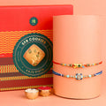 Image of a beautifully designed Rakhi with sweets, the perfect combination of tradition and sweetness for Raksha Bandhan celebration. Shop now at SatvikStore.in. #Rakhi #RakhiOnline #SendRakhi #DesignerRakhi #BeautifulRakhi #LatestRakhi #NewRakhi #ModernRakhi"