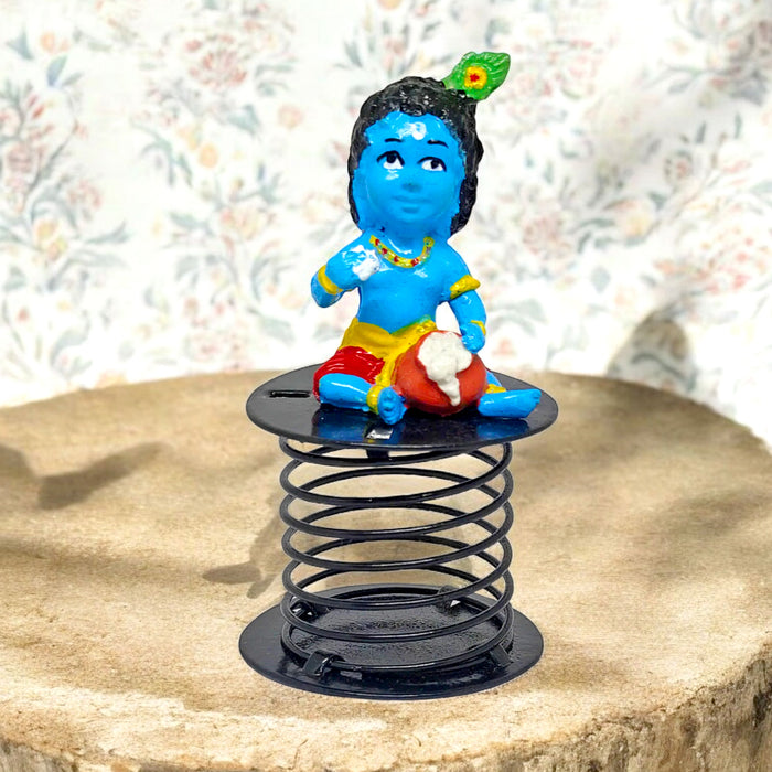 Laddu Gopal idol, beautifully crafted to depict Lord Krishna in his charming childhood form, holding a laddu, symbolizing joy, devotion, and divine blessings. India’s Largest Pooja Accessories Brand – www.satvikstore.in 