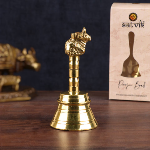 Nandi Brass Puja Bell with detailed carvings of Nandi atop the handle, ideal for temple rituals and daily worship. India’s Largest Pooja Accessories Brand – www.satvikstore.in