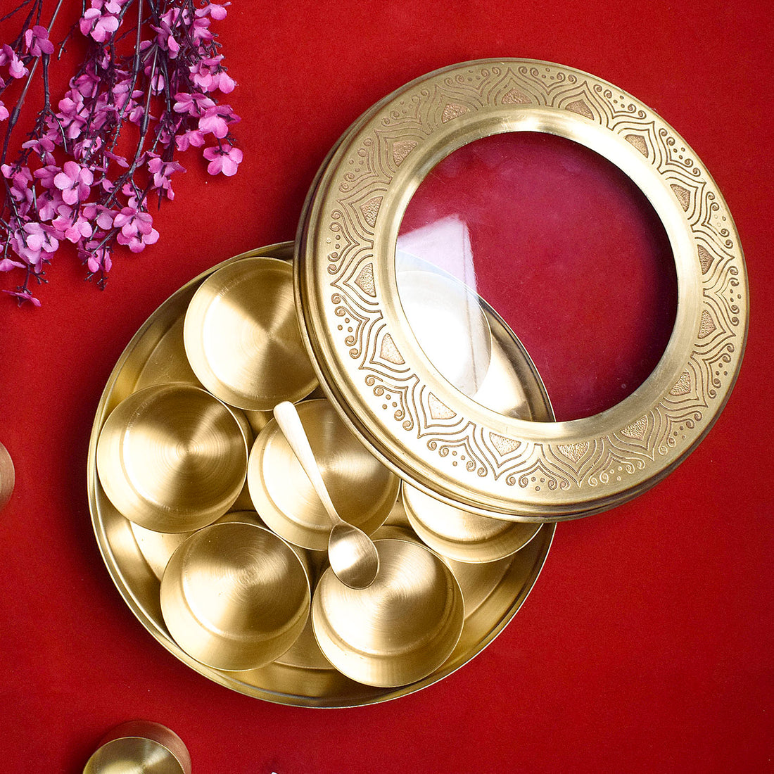 Premium Brass Pooja Samagridaan Set with 7 containers, spoon, and glass lid provides a luxurious and organized solution for storing your sacred puja items, ensuring an elegant and efficient ritual experience – India’s Largest Pooja Accessories Brand – www.satvikstore.in